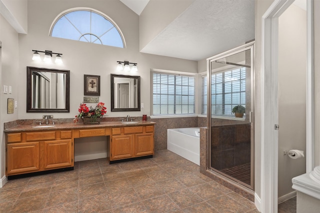 1409 Cherokee St, Deer Park, TX 77536 - full bathroom featuring healthy amount of natural light, a garden tub, a shower stall, and double vanity