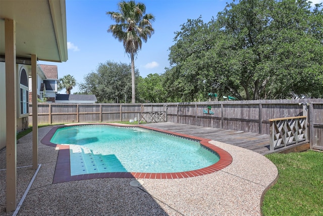 1409 Cherokee St, Deer Park, TX 77536 - view of swimming pool with a fenced backyard, a deck, and a patio area
