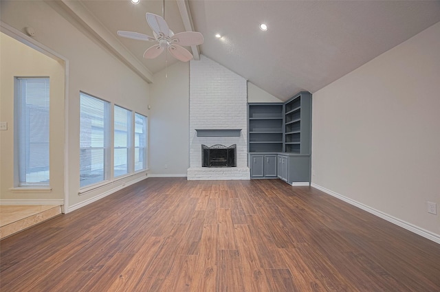 520 S Rivershire Dr, Conroe, TX 77304 - unfurnished living room with ceiling fan, wood finished floors, a fireplace, baseboards, and built in features