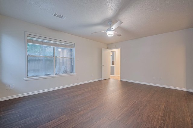 520 S Rivershire Dr, Conroe, TX 77304 - unfurnished room featuring a ceiling fan, dark wood-type flooring, a textured ceiling, and baseboards