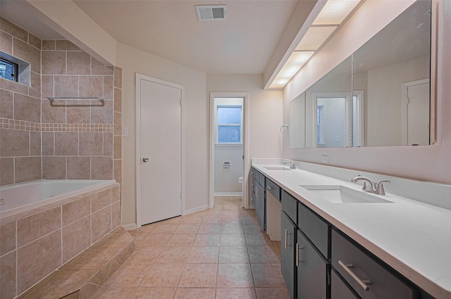 520 S Rivershire Dr, Conroe, TX 77304 - bathroom featuring double vanity, baseboards, toilet, and tile patterned flooring