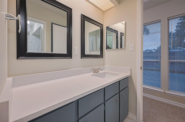 520 S Rivershire Dr, Conroe, TX 77304 - bathroom featuring vanity and baseboards