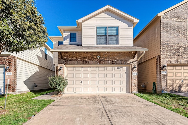 6706 Honey Harvest Ln, Houston, TX 77084 - traditional-style house with driveway, a garage, brick siding, and a front yard