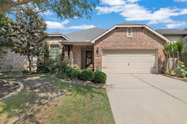 17219 Rookery Ct, Conroe, TX 77385 - view of front of house with brick siding, an attached garage, driveway, and a front lawn