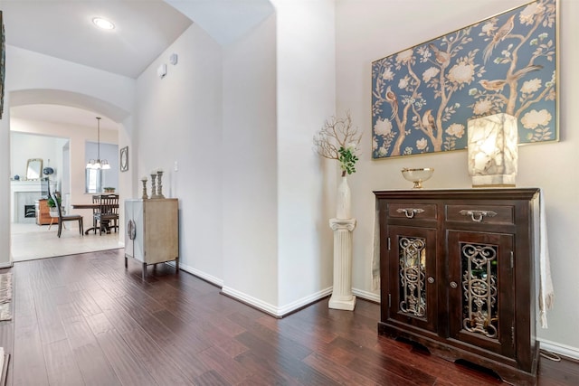 17219 Rookery Ct, Conroe, TX 77385 - foyer entrance with arched walkways, dark wood-style floors, baseboards, and recessed lighting