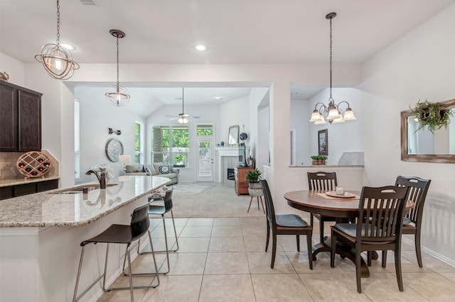 17219 Rookery Ct, Conroe, TX 77385 - dining area featuring a ceiling fan, light carpet, light tile patterned floors, recessed lighting, and vaulted ceiling