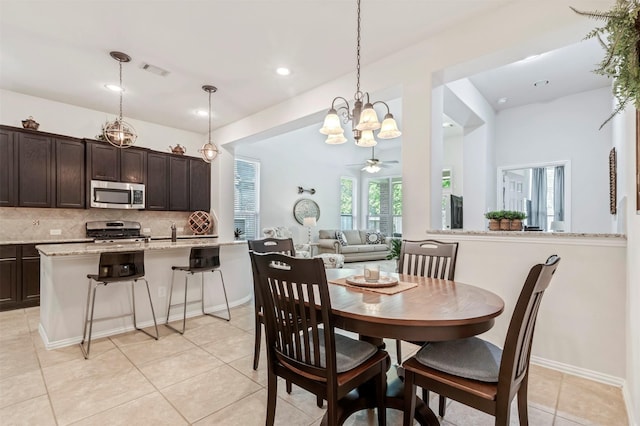 17219 Rookery Ct, Conroe, TX 77385 - dining space featuring a chandelier, light tile patterned floors, recessed lighting, and a ceiling fan
