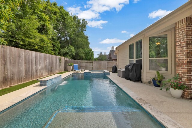 17219 Rookery Ct, Conroe, TX 77385 - view of swimming pool featuring a fenced backyard, grilling area, a patio area, and a pool with connected hot tub
