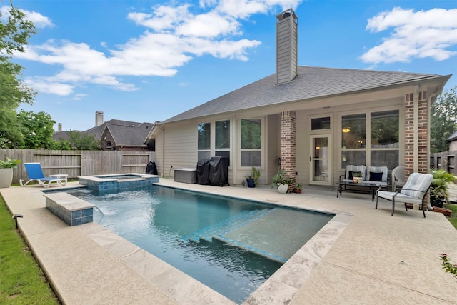 17219 Rookery Ct, Conroe, TX 77385 - view of swimming pool featuring a patio, a pool with connected hot tub, and area for grilling