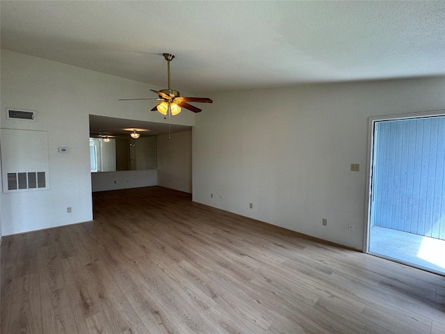 7400 Bellerive Dr Unit 1004, Houston, TX 77036 - unfurnished living room with a ceiling fan, wood finished floors, and lofted ceiling