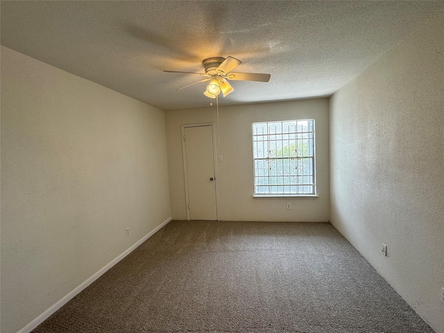 7400 Bellerive Dr Unit 1004, Houston, TX 77036 - empty room featuring carpet, a ceiling fan, a textured wall, and a textured ceiling