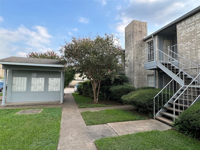 7400 Bellerive Dr Unit 1004, Houston, TX 77036 - view of yard with stairs and mail area