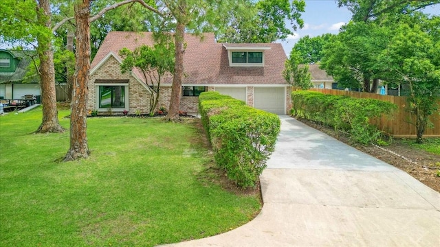 2506 Swan Ct, Houston, TX 77058 - view of front facade featuring brick siding, driveway, a garage, and roof with shingles