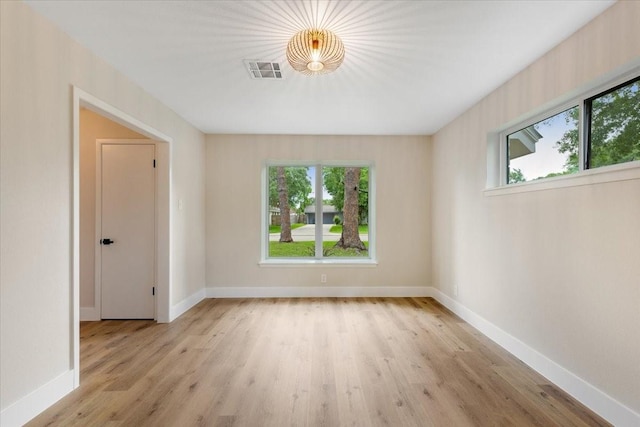 2506 Swan Ct, Houston, TX 77058 - unfurnished room with healthy amount of natural light, light wood finished floors, and baseboards