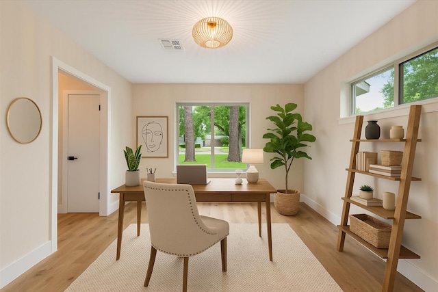 2506 Swan Ct, Houston, TX 77058 - home office featuring baseboards and light wood finished floors