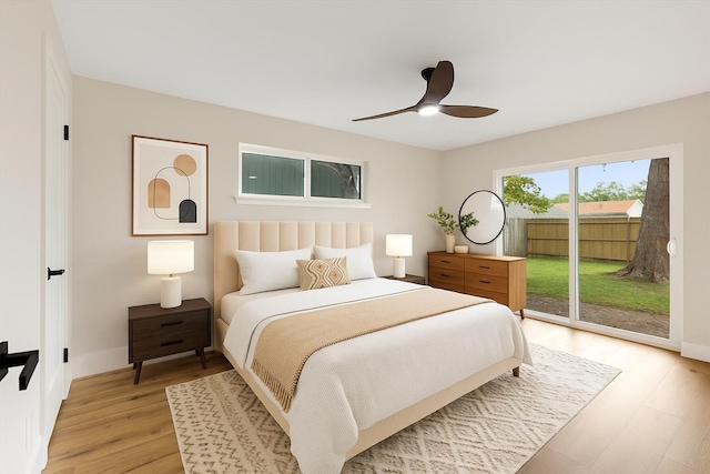 2506 Swan Ct, Houston, TX 77058 - bedroom with access to exterior, light wood-type flooring, ceiling fan, and baseboards
