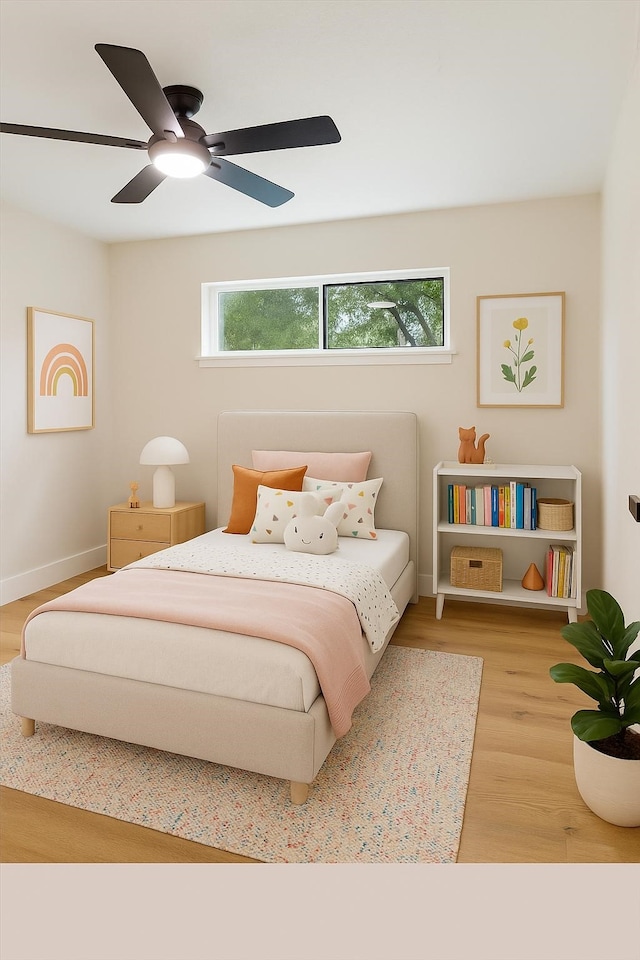 2506 Swan Ct, Houston, TX 77058 - bedroom with wood finished floors, baseboards, and ceiling fan