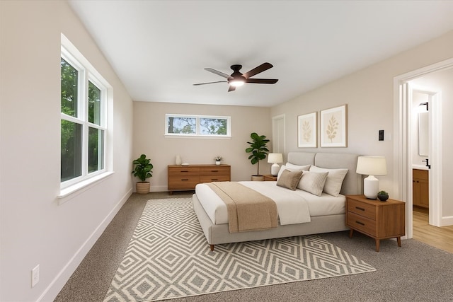 2506 Swan Ct, Houston, TX 77058 - bedroom with baseboards, light carpet, and a ceiling fan