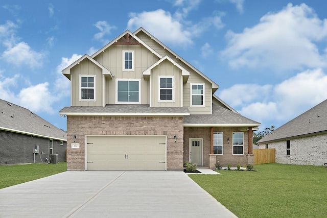 201 Big Spring Dr, Anahuac, TX 77514 - craftsman house featuring concrete driveway, a garage, brick siding, central AC, and board and batten siding