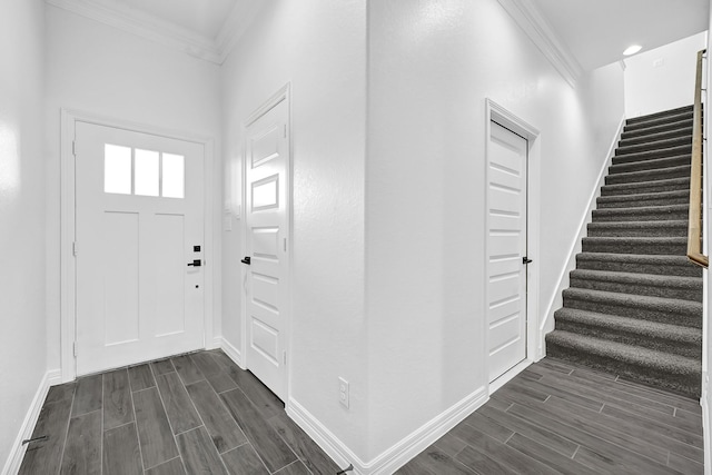 201 Big Spring Dr, Anahuac, TX 77514 - entrance foyer with crown molding, stairs, wood tiled floors, and baseboards