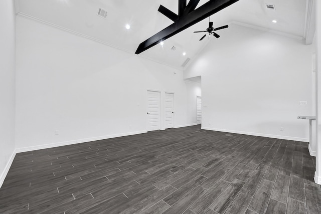 201 Big Spring Dr, Anahuac, TX 77514 - spare room with beam ceiling, a ceiling fan, dark wood finished floors, baseboards, and high vaulted ceiling