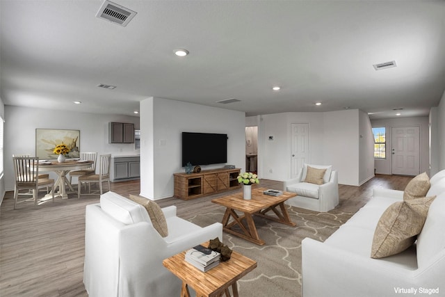 living room featuring recessed lighting and light wood-style floors