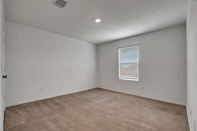 empty room with carpet floors and baseboards
