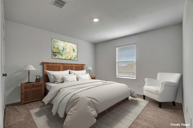 carpeted bedroom featuring baseboards