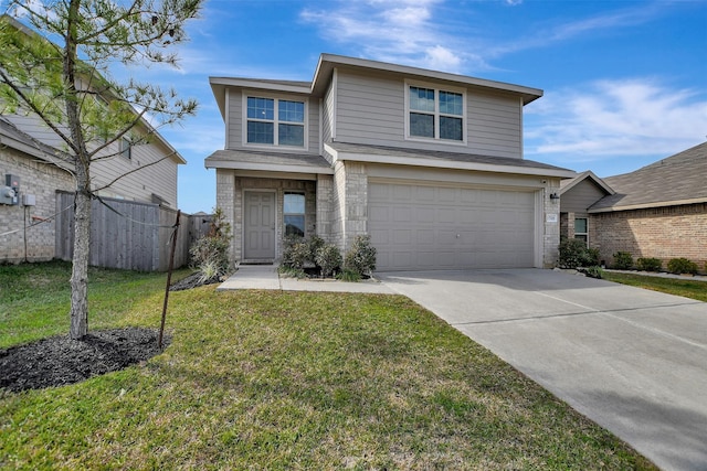traditional-style home featuring concrete driveway, a front yard, a garage, and fence