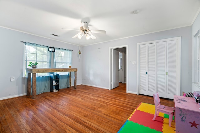 815 Iwo St, Alvin, TX 77511 - recreation room with a ceiling fan, ornamental molding, wood finished floors, and baseboards
