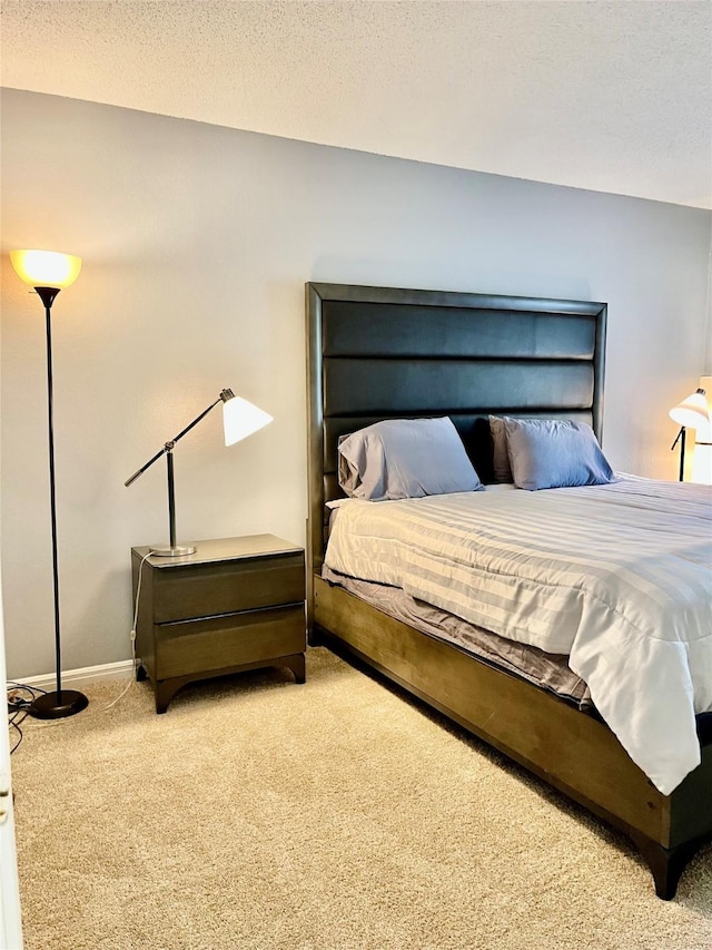 bedroom with carpet and baseboards
