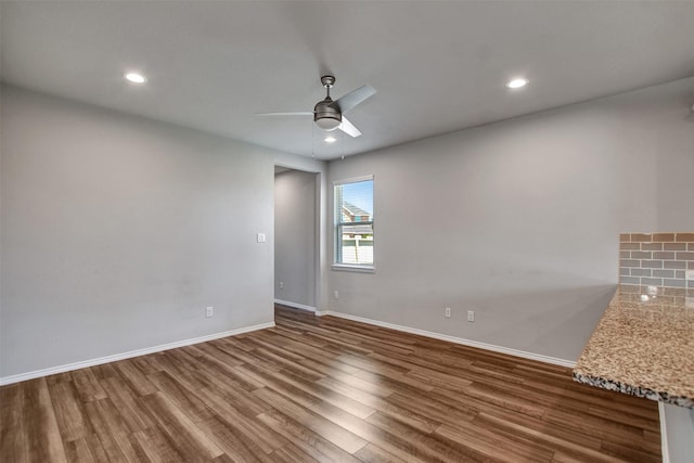9244 Inland Leather Ln, Conroe, TX 77385 - unfurnished room with wood finished floors, a ceiling fan, baseboards, and recessed lighting