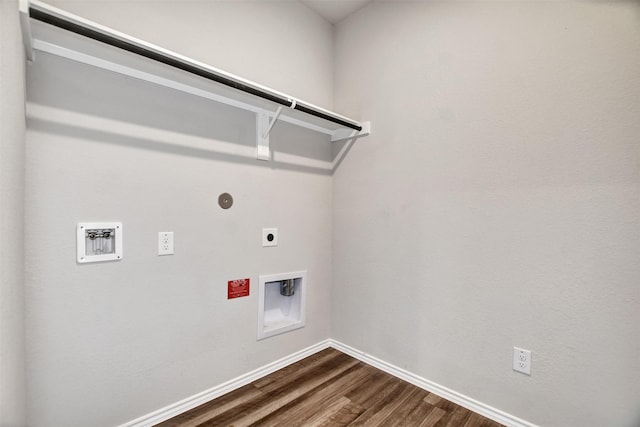 clothes washing area featuring dark wood-style flooring, electric dryer hookup, hookup for a washing machine, and baseboards