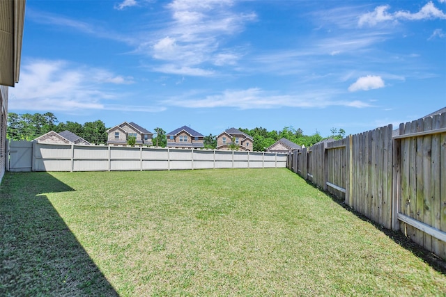 view of yard featuring a residential view