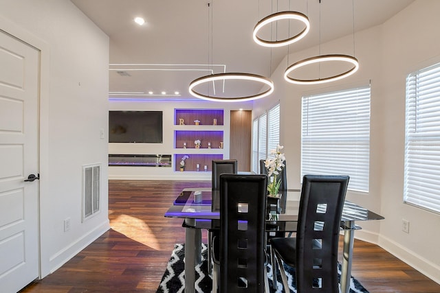 dining area with wood finished floors and baseboards