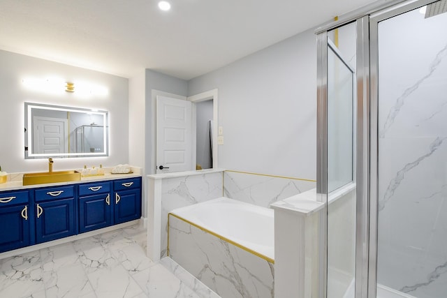 bathroom featuring marble finish flooring, a marble finish shower, vanity, and a bath