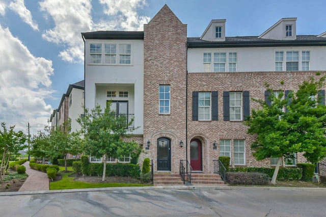 9450 London Bridge Sta, Houston, TX 77045 - view of property featuring stucco siding and brick siding