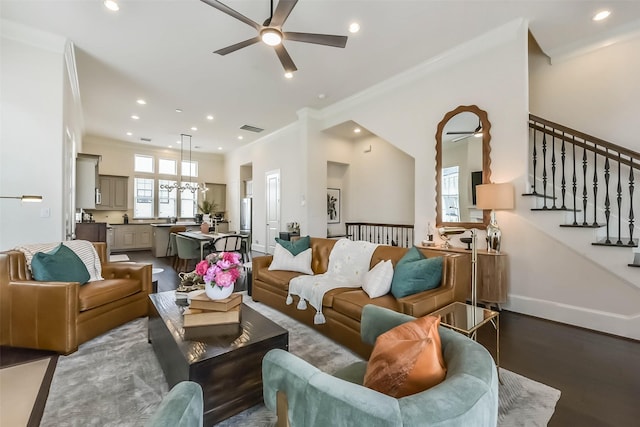 9450 London Bridge Sta, Houston, TX 77045 - living area with a ceiling fan, crown molding, recessed lighting, wood finished floors, and stairway