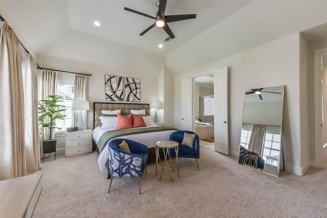 9450 London Bridge Sta, Houston, TX 77045 - carpeted bedroom featuring multiple windows, recessed lighting, vaulted ceiling, a ceiling fan, and connected bathroom