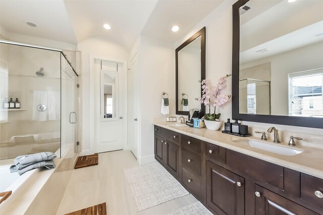 9450 London Bridge Sta, Houston, TX 77045 - bathroom featuring a shower stall, double vanity, recessed lighting, a bath, and tile patterned floors