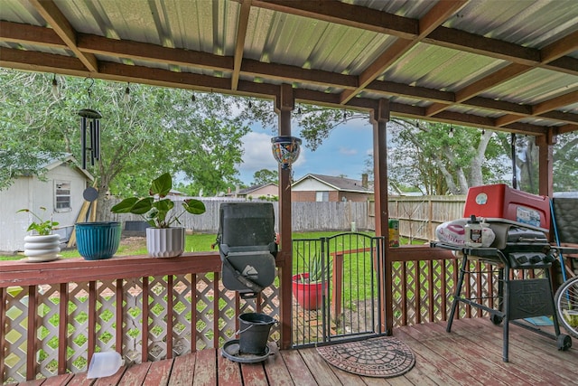11427 Sageglen Dr, Houston, TX 77089 - deck featuring a fenced backyard, a storage unit, and an outbuilding