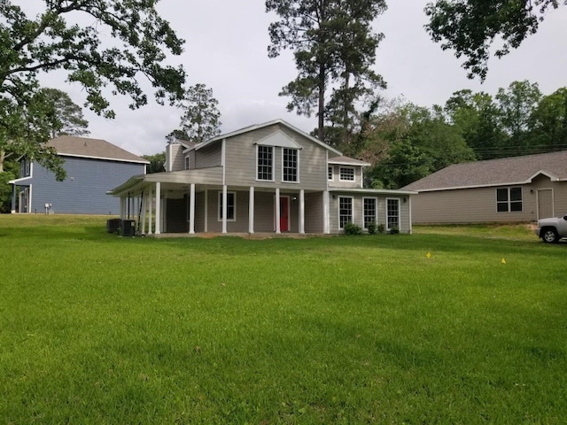 1305 Saint Lawrence River Rd, Conroe, TX 77316 - rear view of property featuring a lawn and covered porch