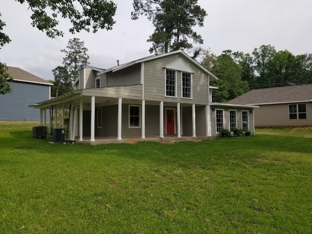 1305 Saint Lawrence River Rd, Conroe, TX 77316 - back of property featuring central air condition unit, a lawn, and a porch
