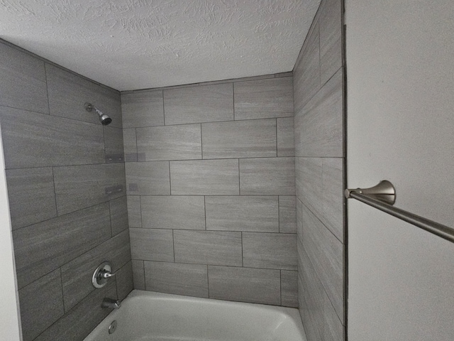 1305 Saint Lawrence River Rd, Conroe, TX 77316 - full bath featuring a textured ceiling and bathing tub / shower combination