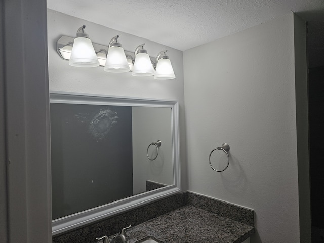 1305 Saint Lawrence River Rd, Conroe, TX 77316 - bathroom featuring a textured ceiling and vanity