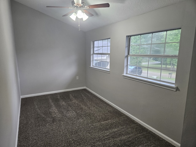 1305 Saint Lawrence River Rd, Conroe, TX 77316 - empty room with ceiling fan, baseboards, and dark colored carpet