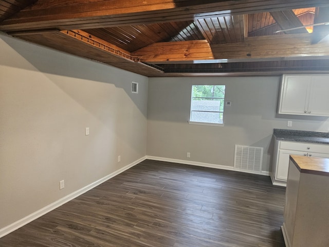 1305 Saint Lawrence River Rd, Conroe, TX 77316 - unfurnished dining area with baseboards, wood ceiling, dark wood-style flooring, and beamed ceiling