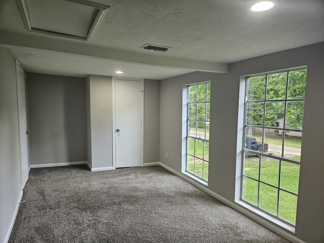 1305 Saint Lawrence River Rd, Conroe, TX 77316 - carpeted spare room with baseboards, recessed lighting, a textured ceiling, and attic access