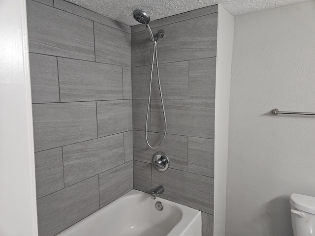 1305 Saint Lawrence River Rd, Conroe, TX 77316 - bathroom with toilet, a textured ceiling, and shower / washtub combination