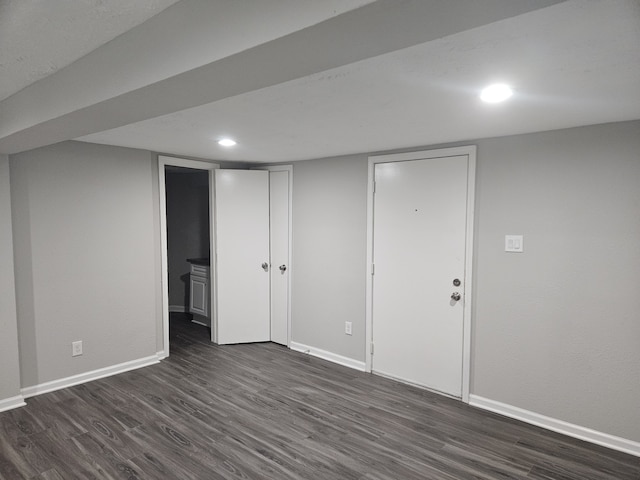 1305 Saint Lawrence River Rd, Conroe, TX 77316 - finished below grade area with dark wood finished floors, baseboards, and recessed lighting